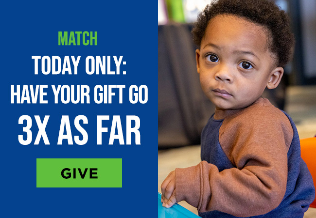 A toddler looking at the camera with a serious expression on his face. A headline reads: Match, today only. Have your gift go 3 times as far. A button reads: Give
