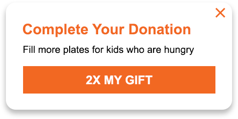 A headline reads: Complete your donation. Fill more plates for kids who are hungry. A button reads: 2x my gift.